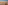 Panoramic Seville cityscape at golden hour, featuring Giralda tower and cathedral.