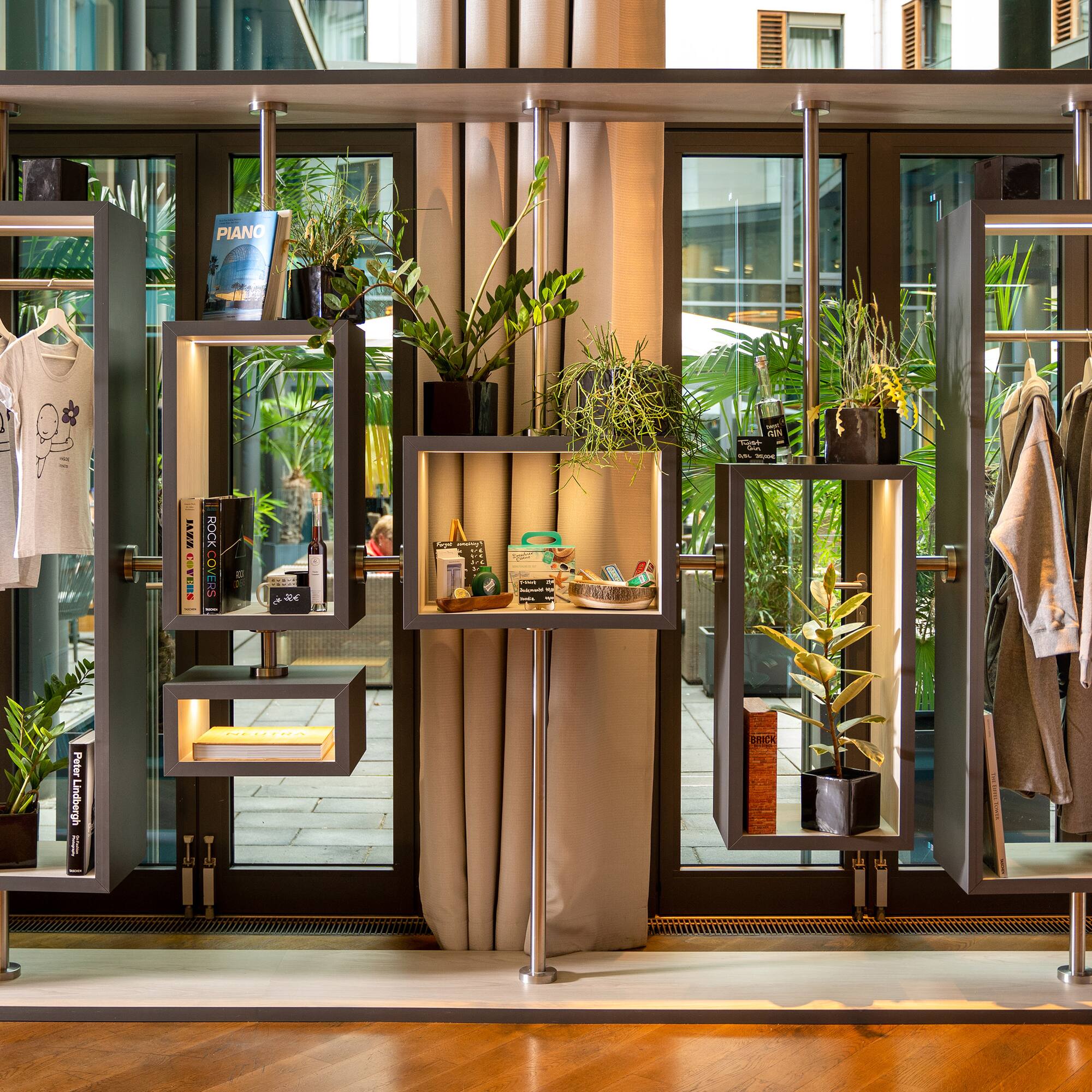 a display of clothing and plants