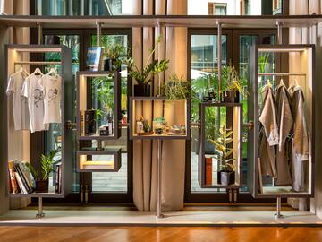 a display of clothing and plants