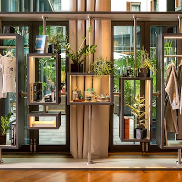 a display of clothing and plants