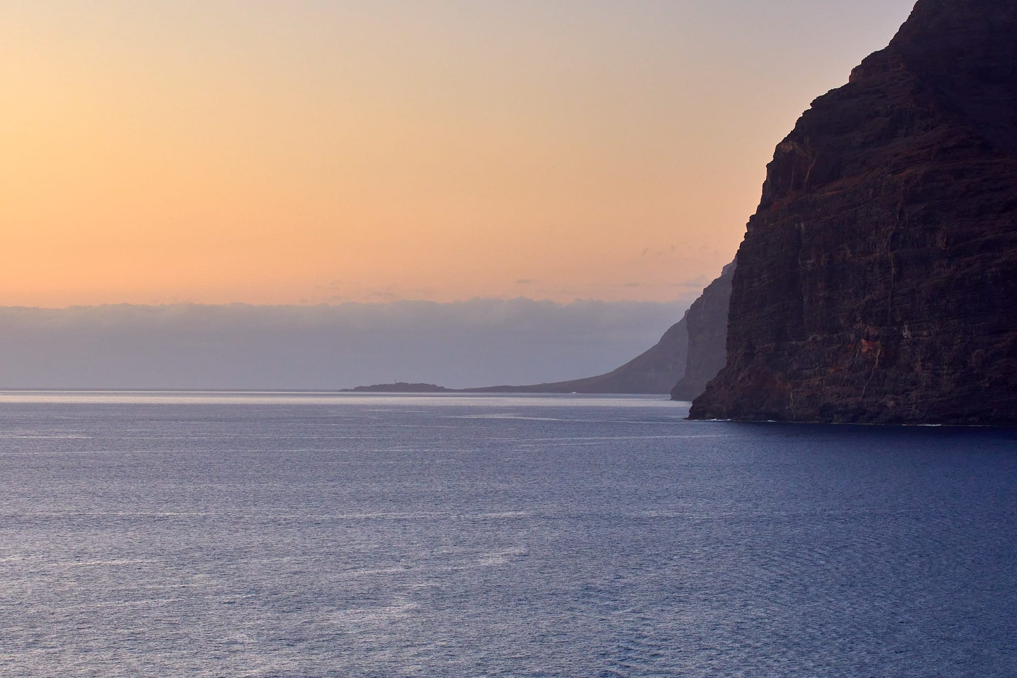 a body of water with a boat in the distance