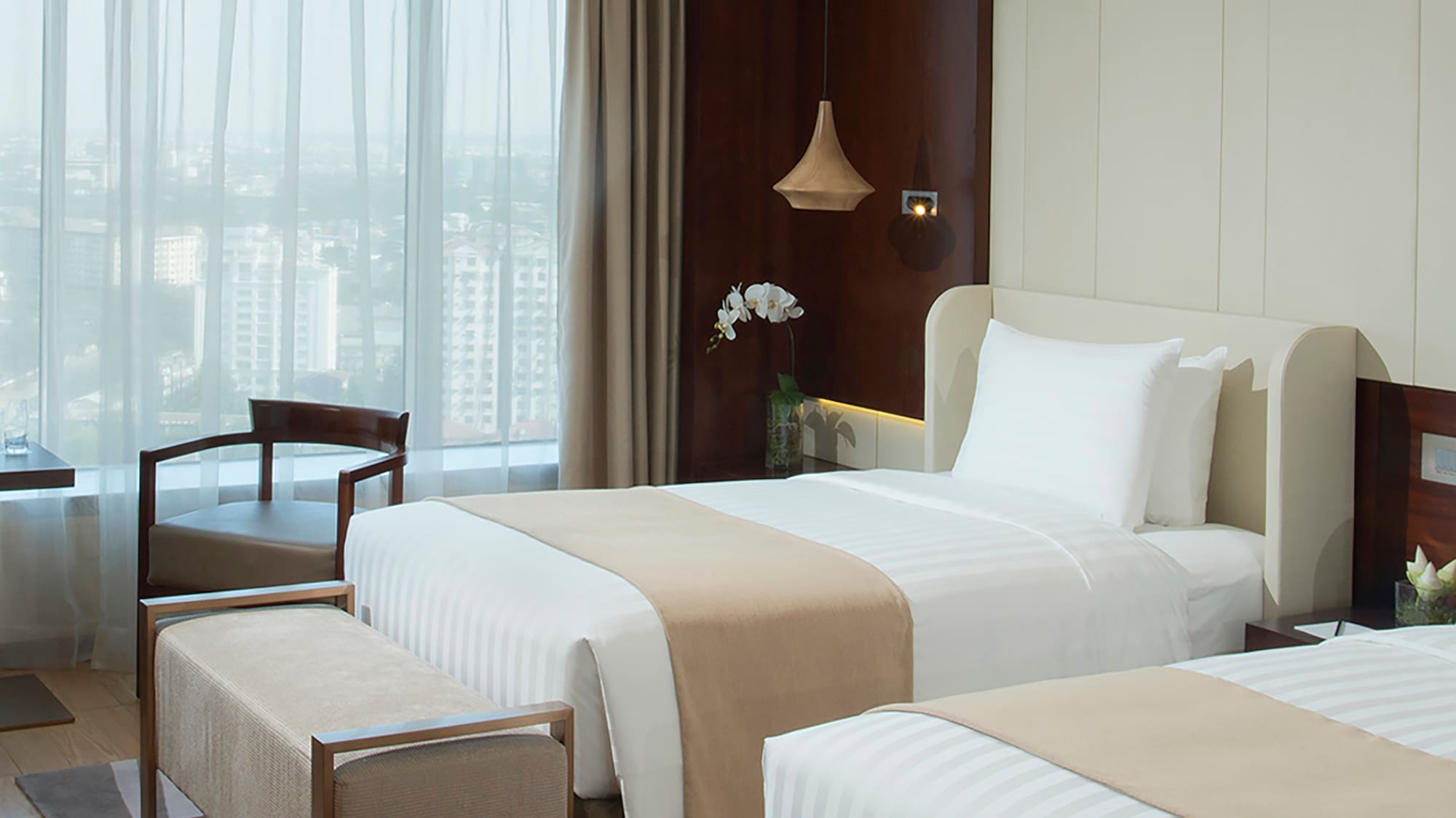 a room with two beds and a window