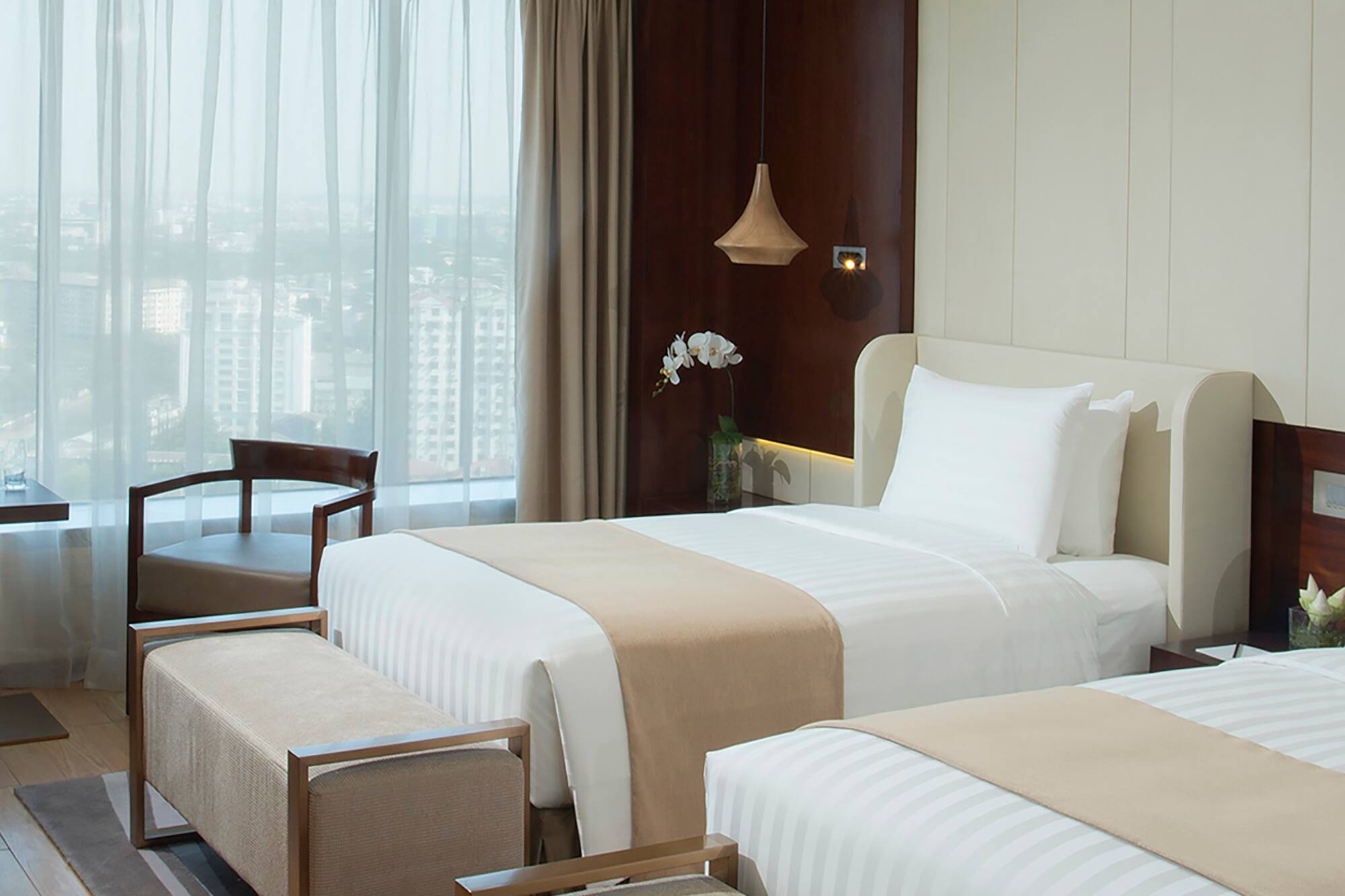 a room with two beds and a window