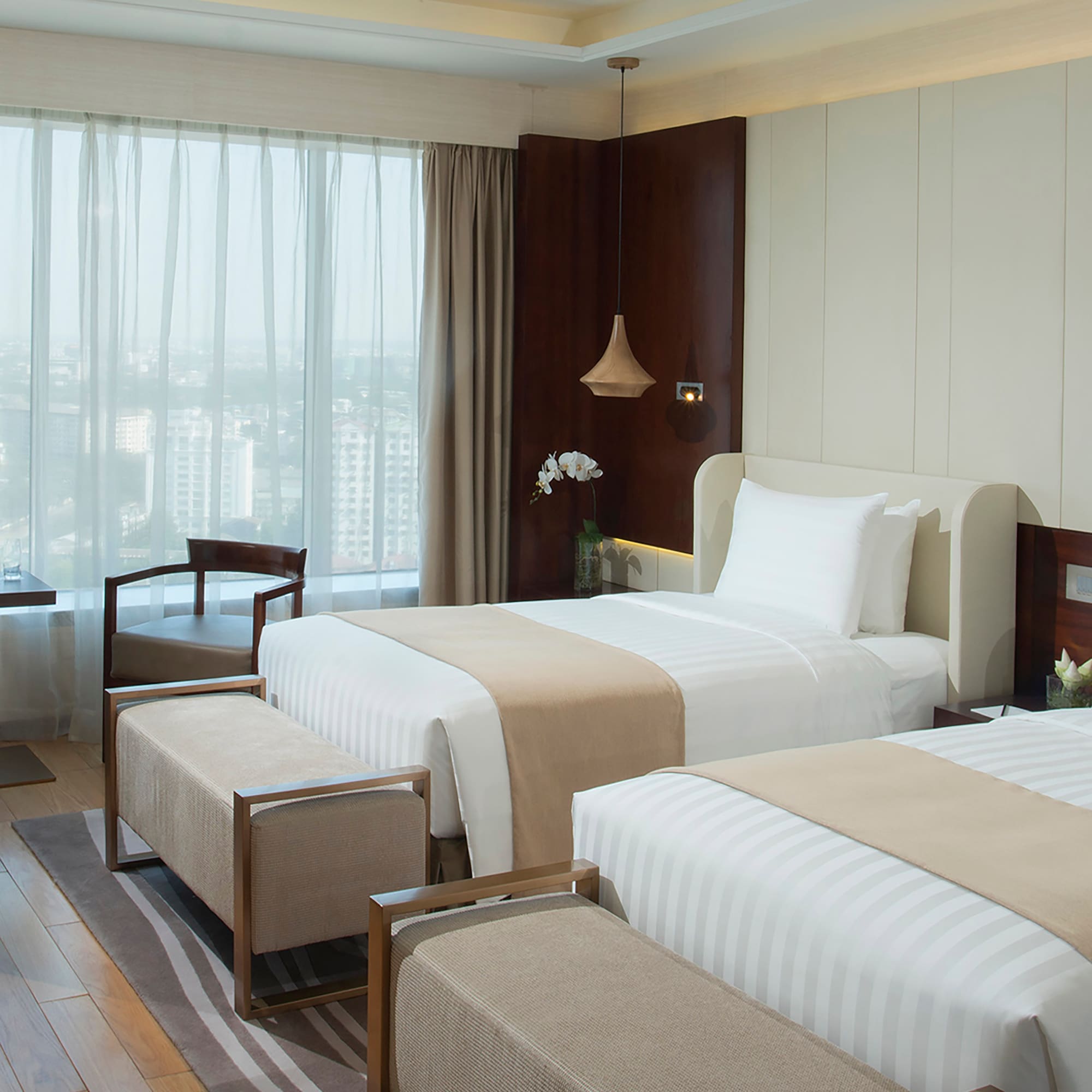 a room with two beds and a window