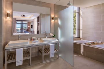 a bathroom with a large mirror and sink