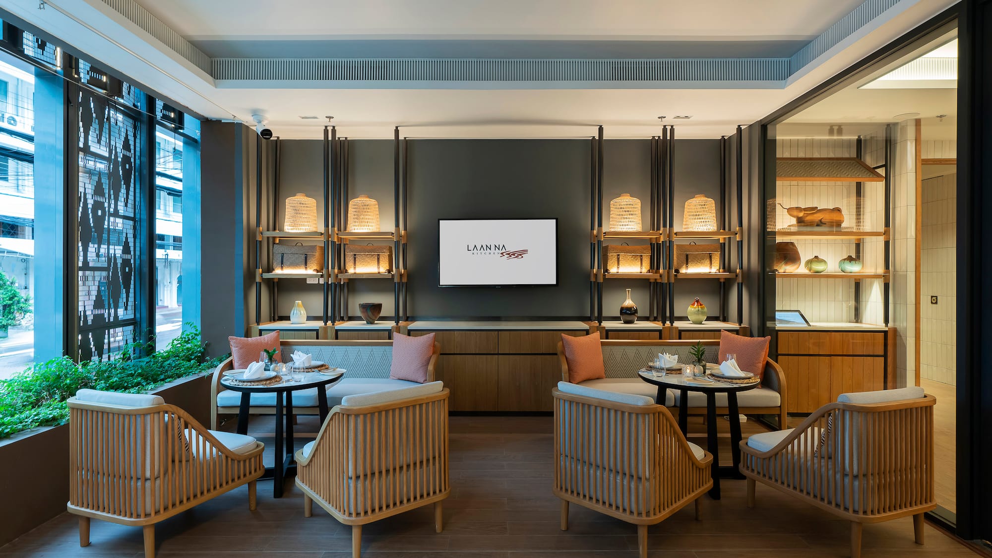 a room with a television and tables