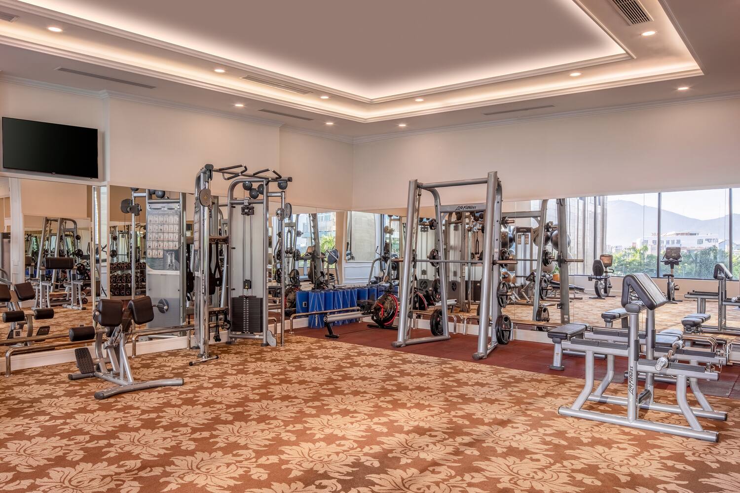a large room with gym equipment
