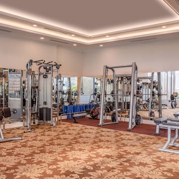 a large room with gym equipment