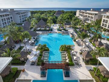 a swimming pool surrounded by palm trees