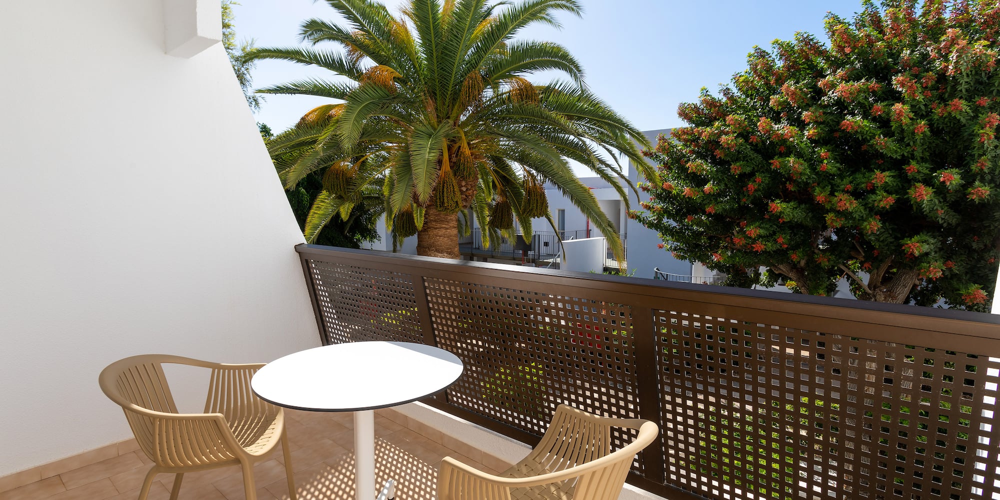 a table and chairs on a balcony