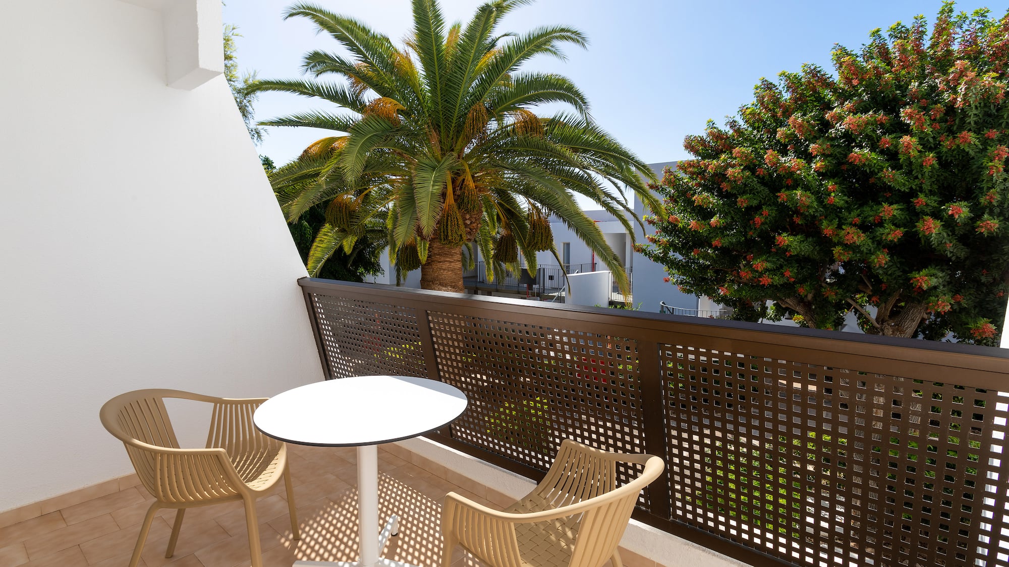 a table and chairs on a balcony