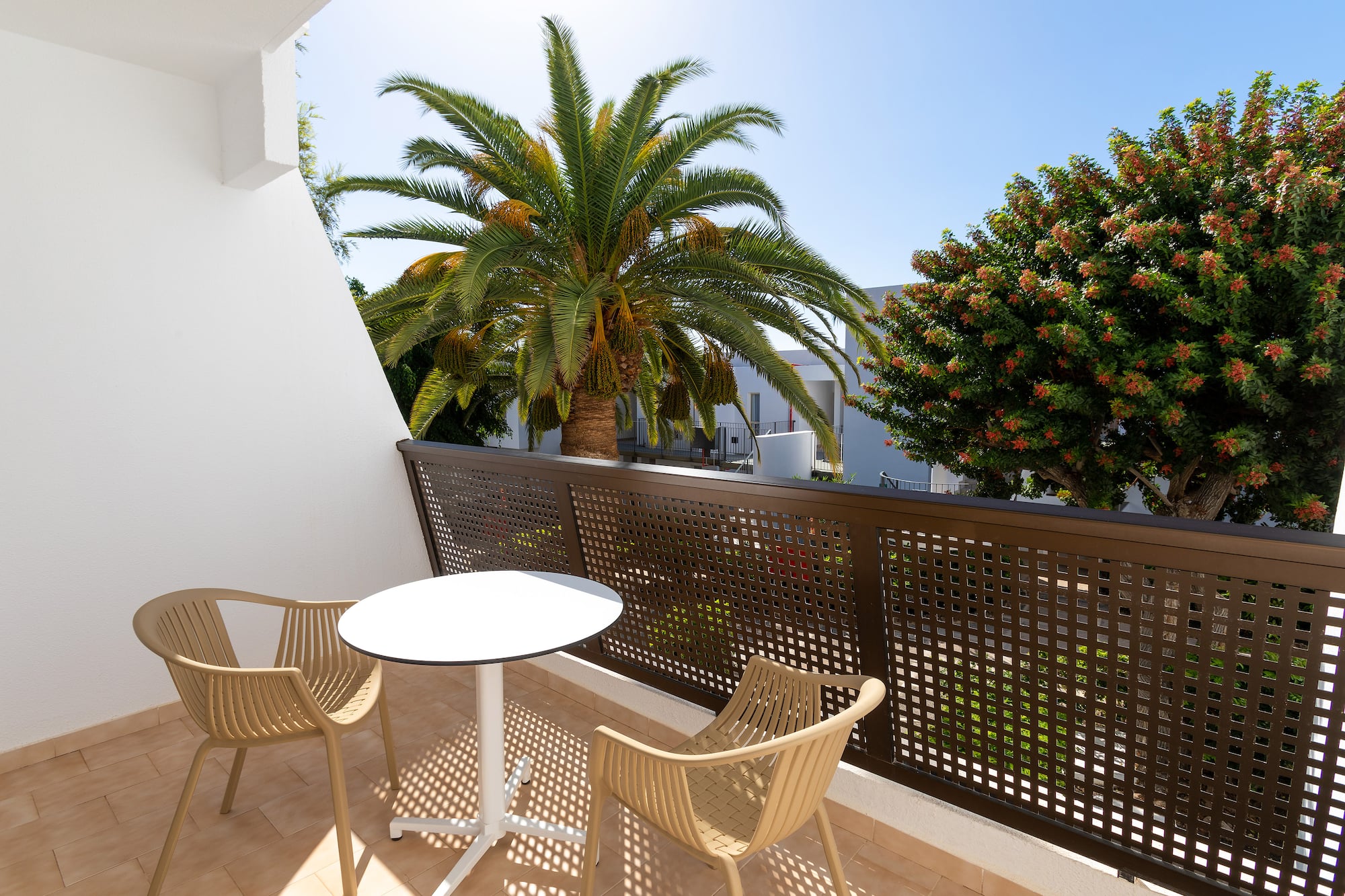 a table and chairs on a balcony