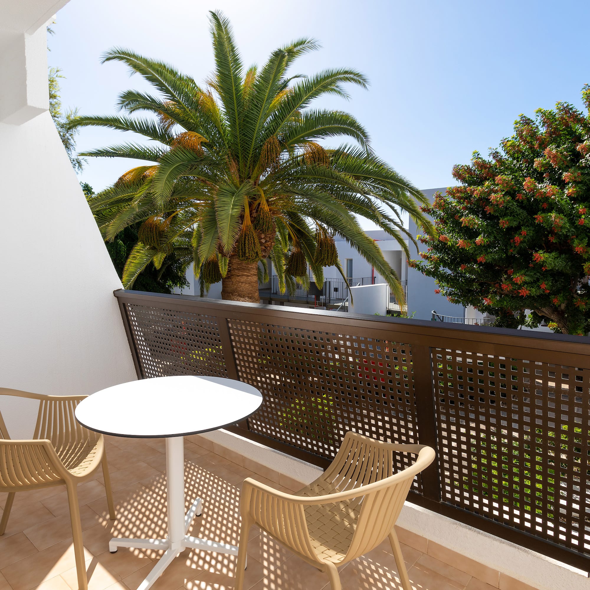 a table and chairs on a balcony