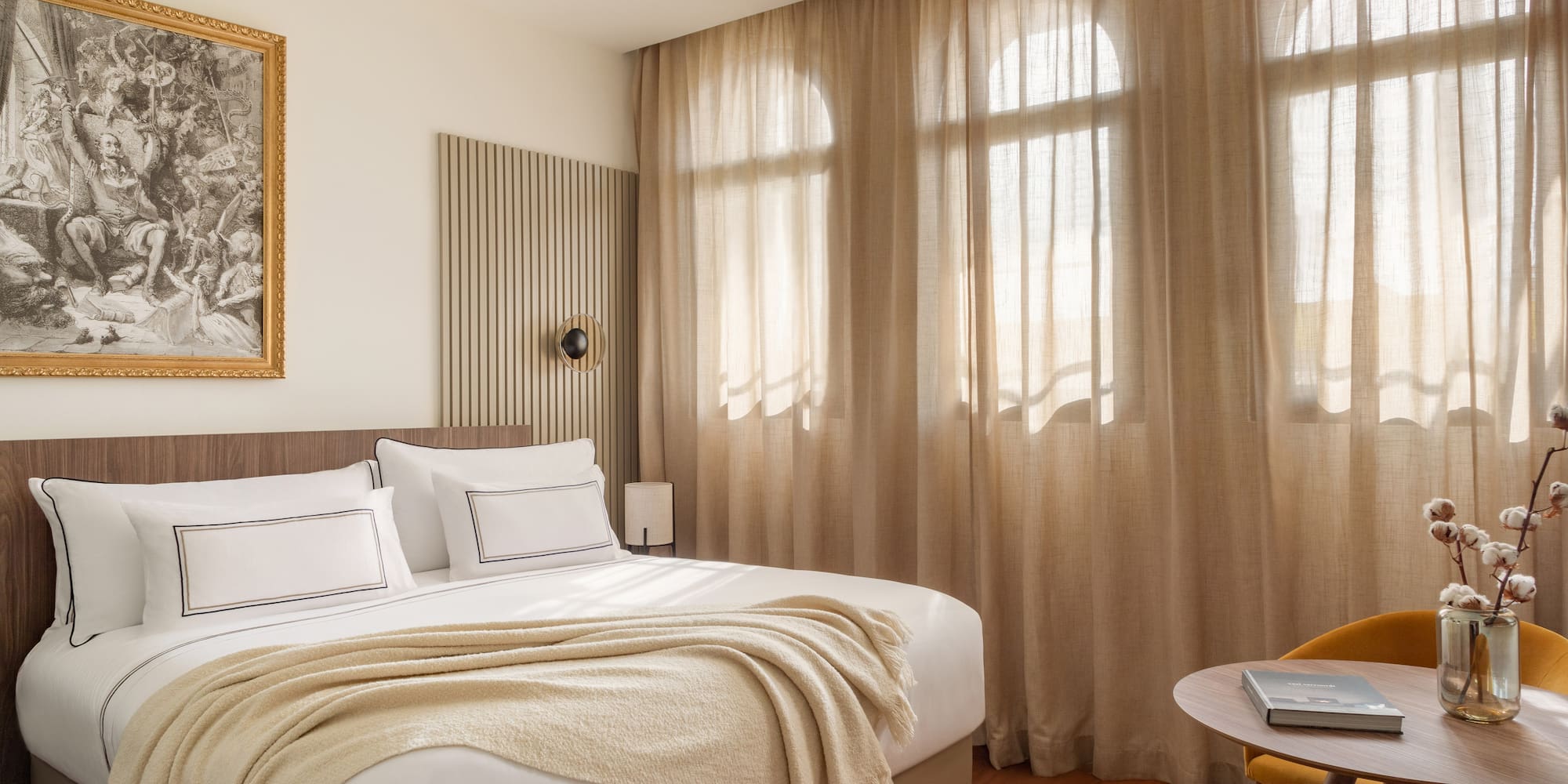 a bedroom with a bed and a table