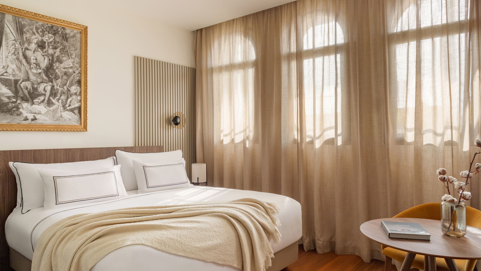 a bedroom with a bed and a table