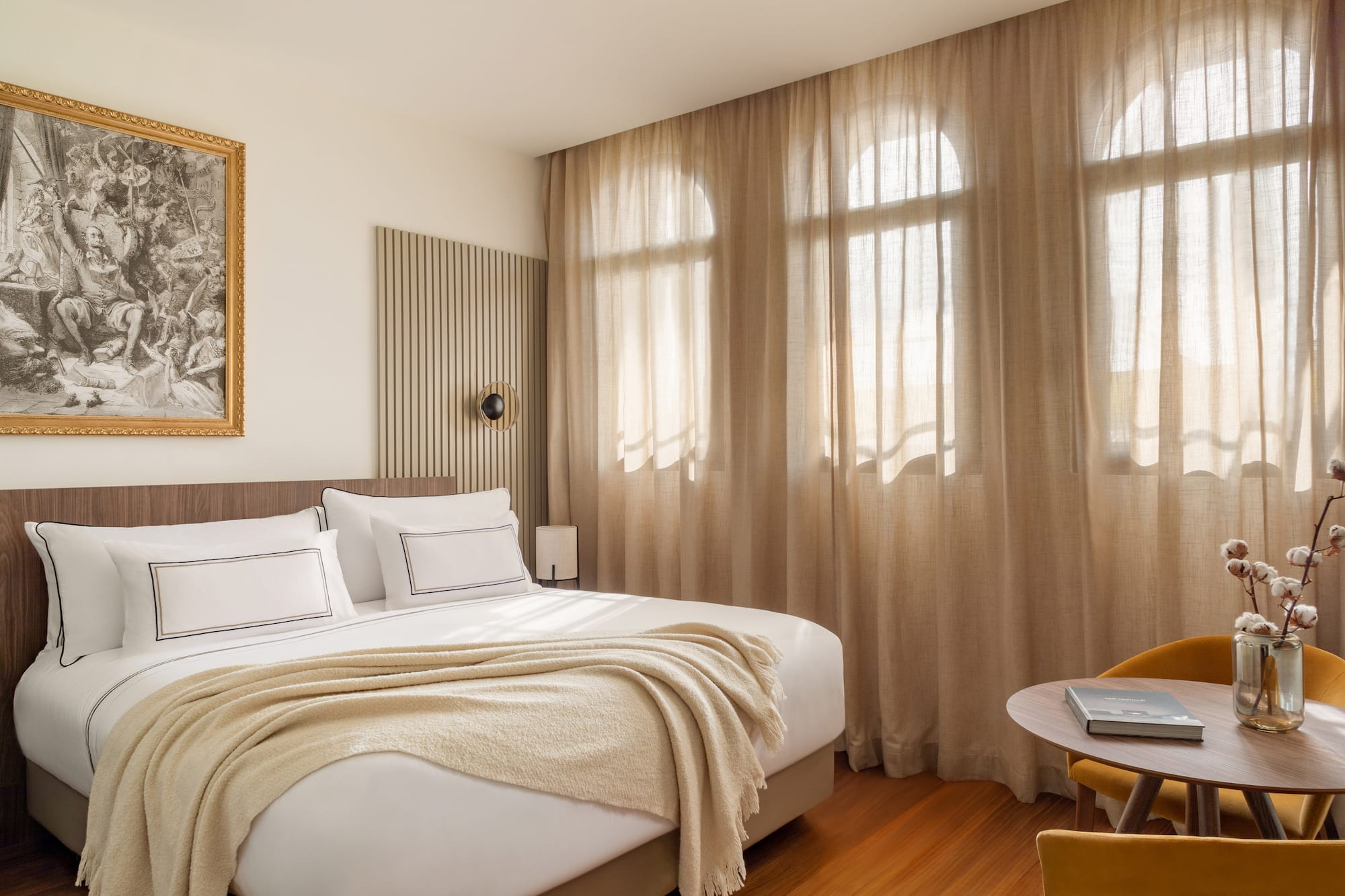 a bedroom with a bed and a chair