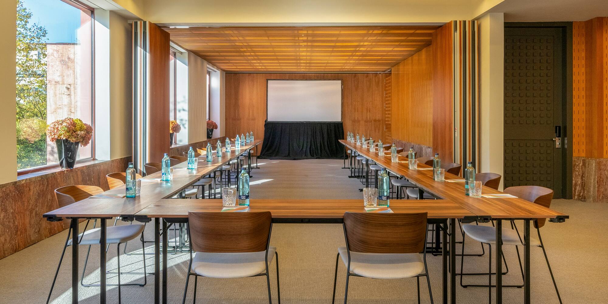 a room with a large table and chairs