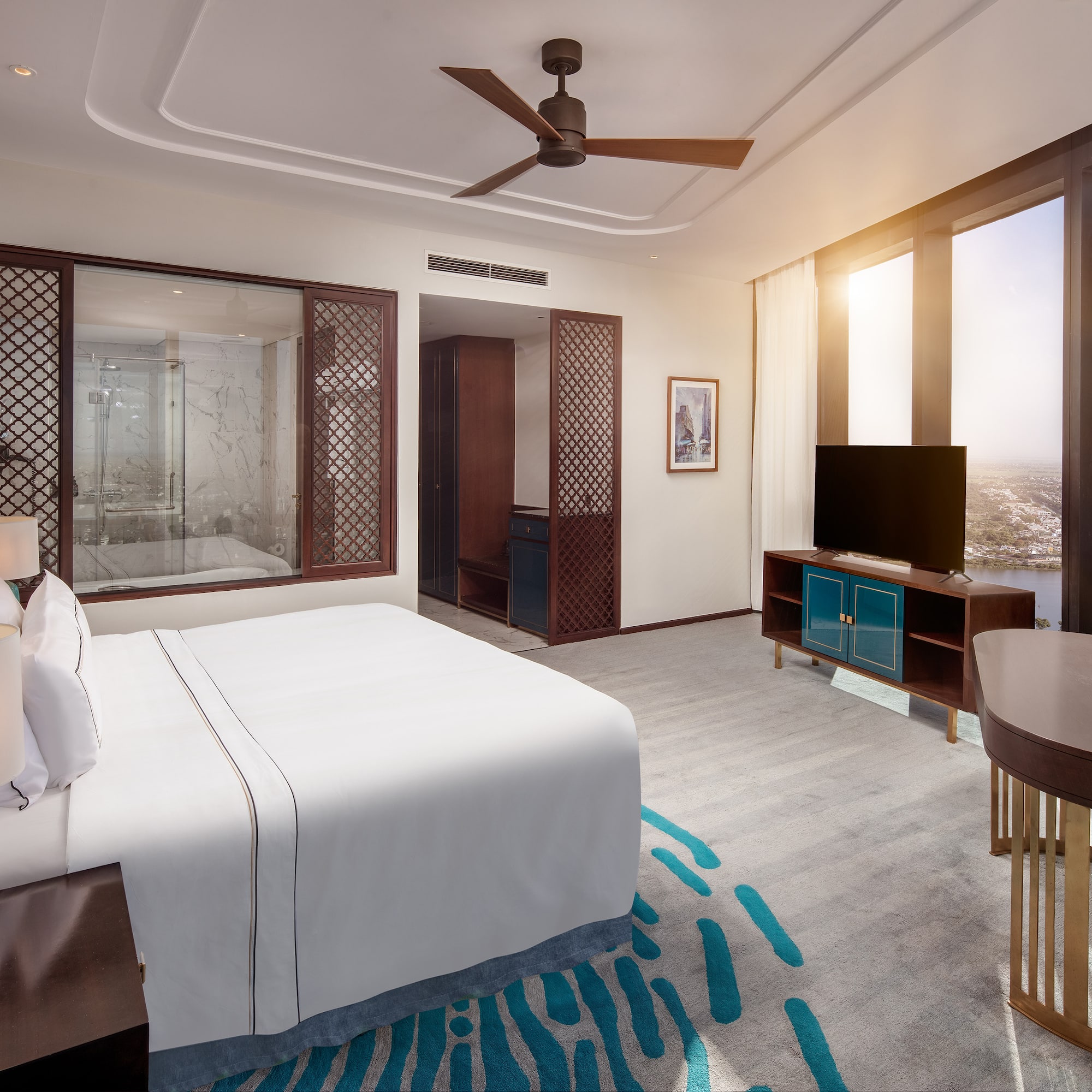 a room with a bed and a television