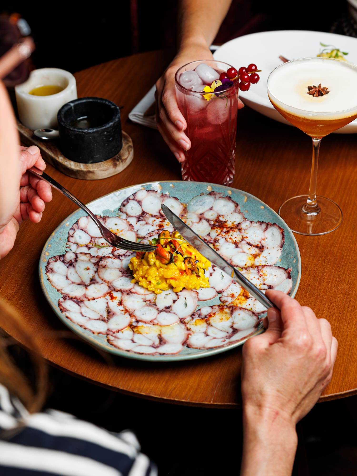 a person eating food on a plate