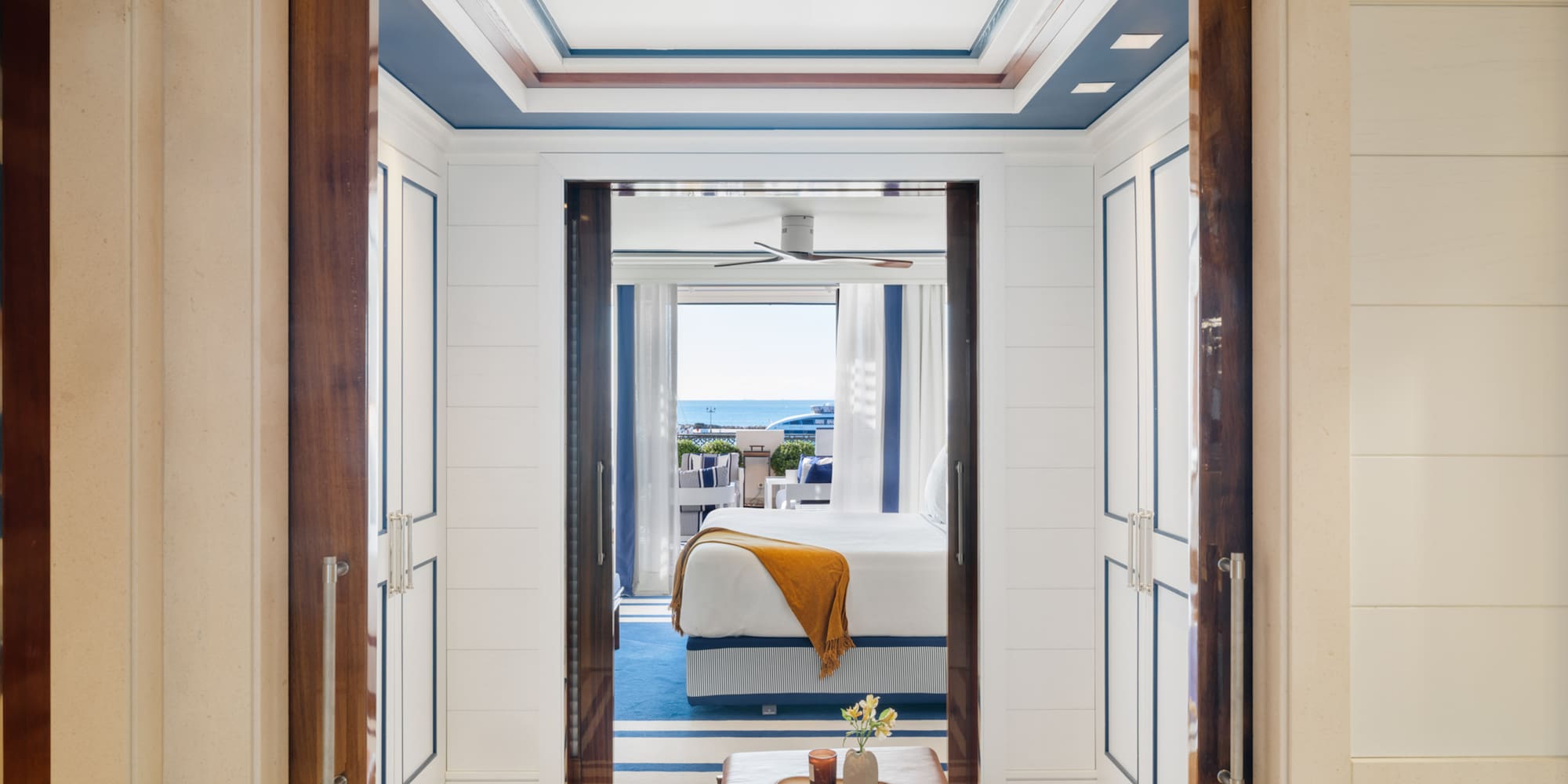 a room with a bed and a bench