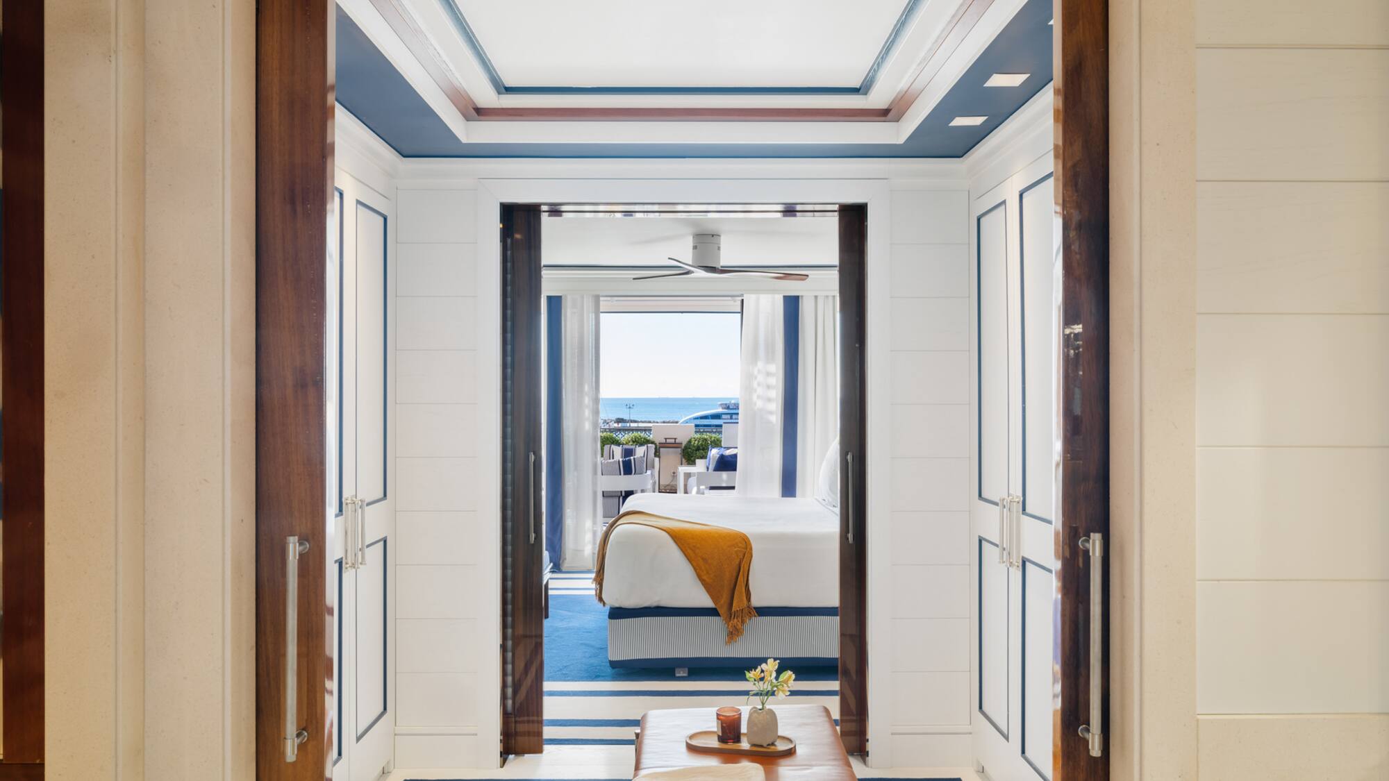 a room with a bed and a bench