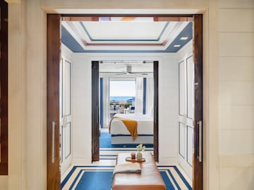 a room with a bed and a bench