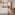 Modern hotel studio apartment with twin beds, kitchenette, balcony, and sea view.