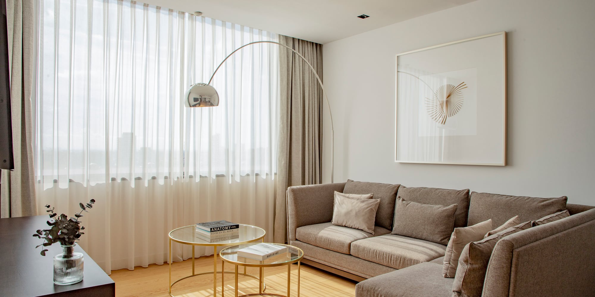 a living room with a couch and a lamp