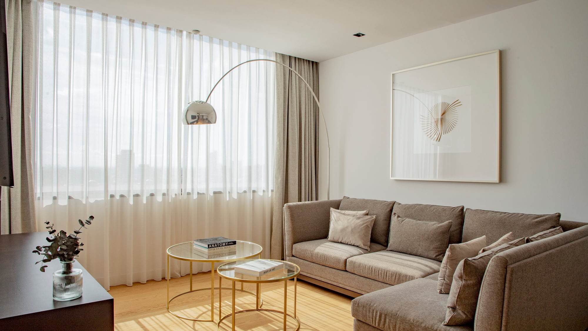 a living room with a couch and a lamp