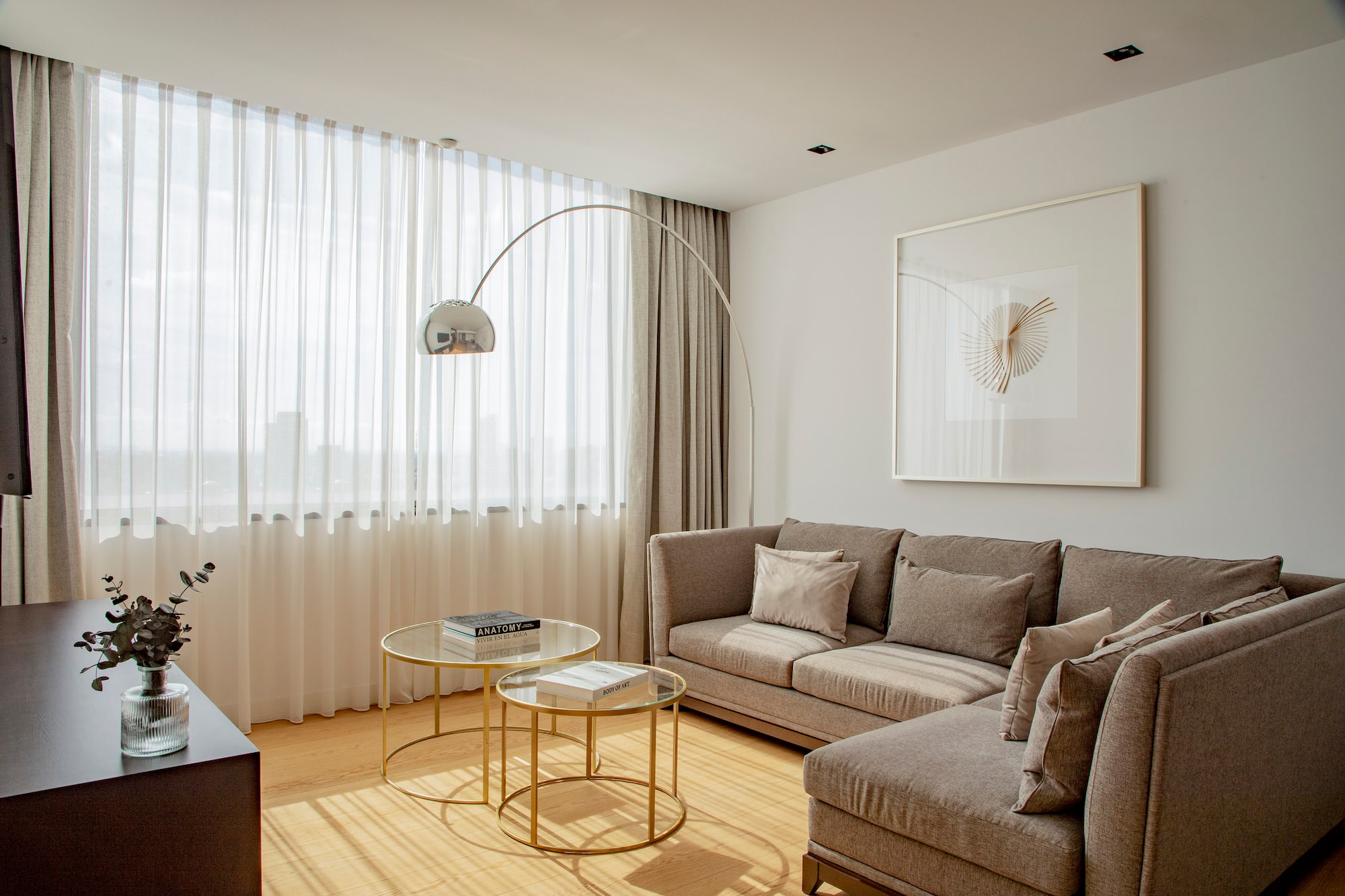 a living room with a couch and a lamp