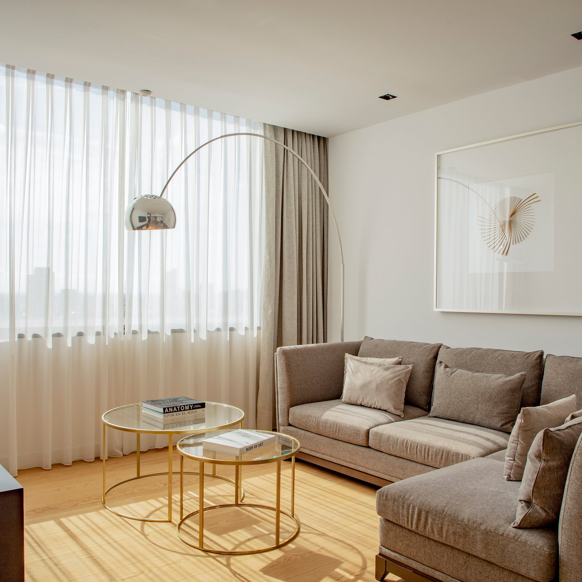 a living room with a couch and a lamp