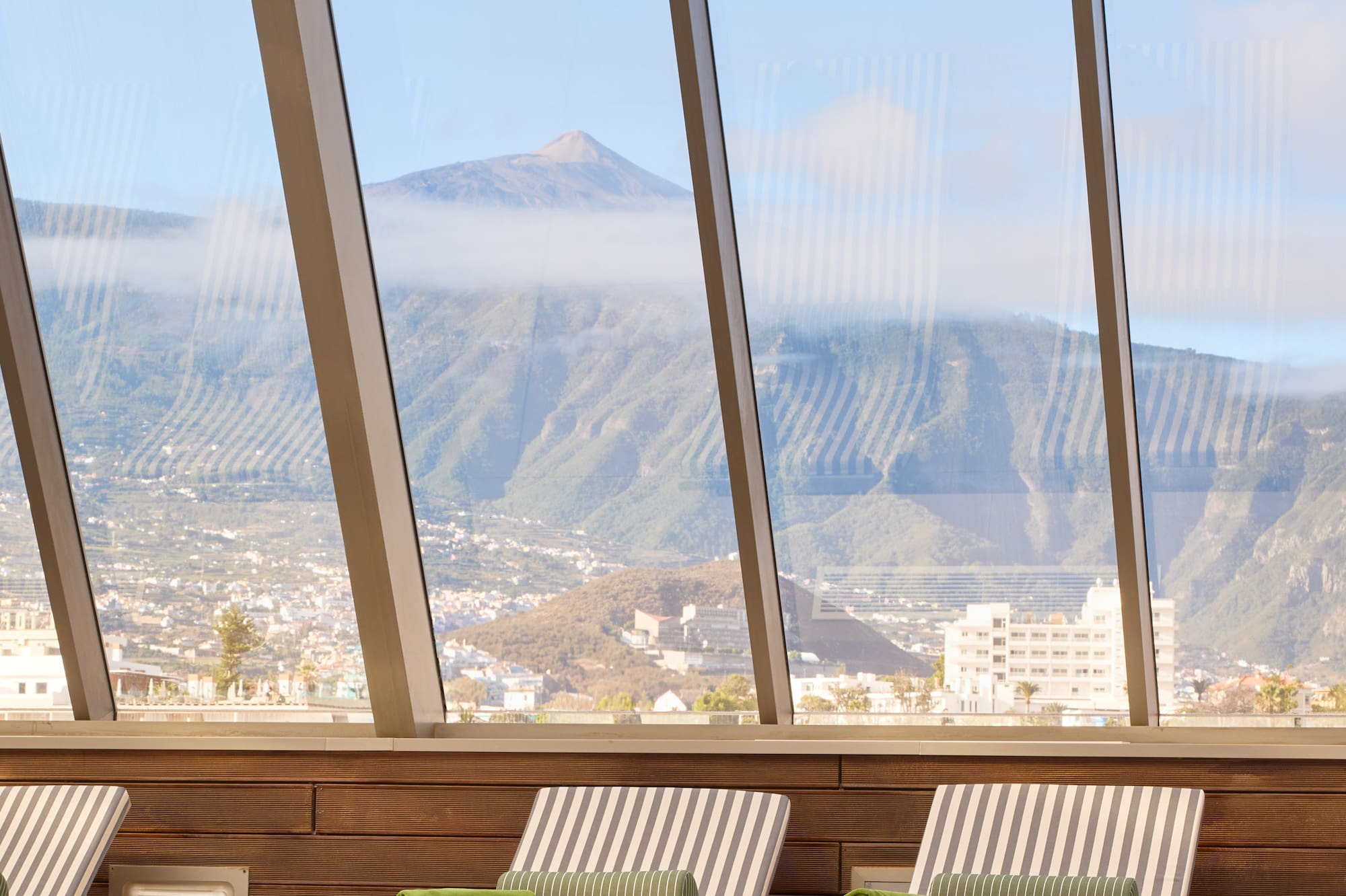 chairs in a room with large windows