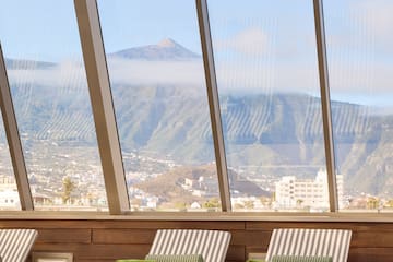 chairs in a room with large windows