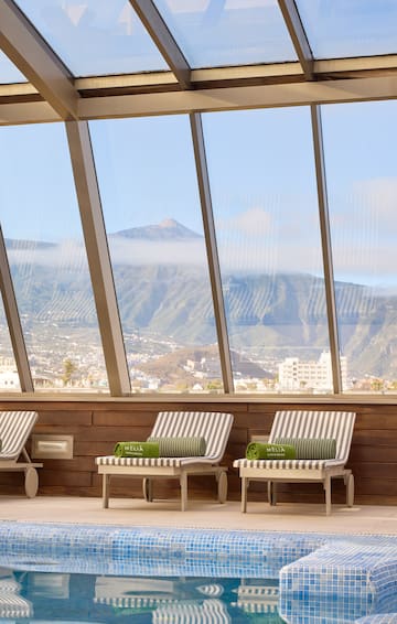 chairs in a room with large windows