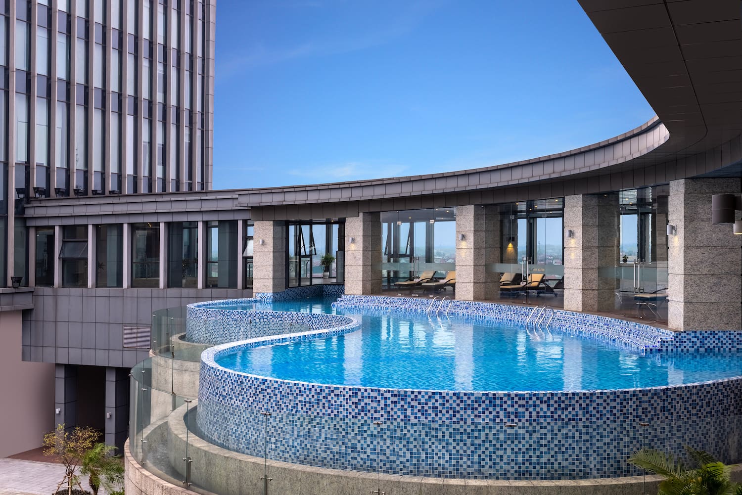 a pool with a circular pool in the middle of a building
