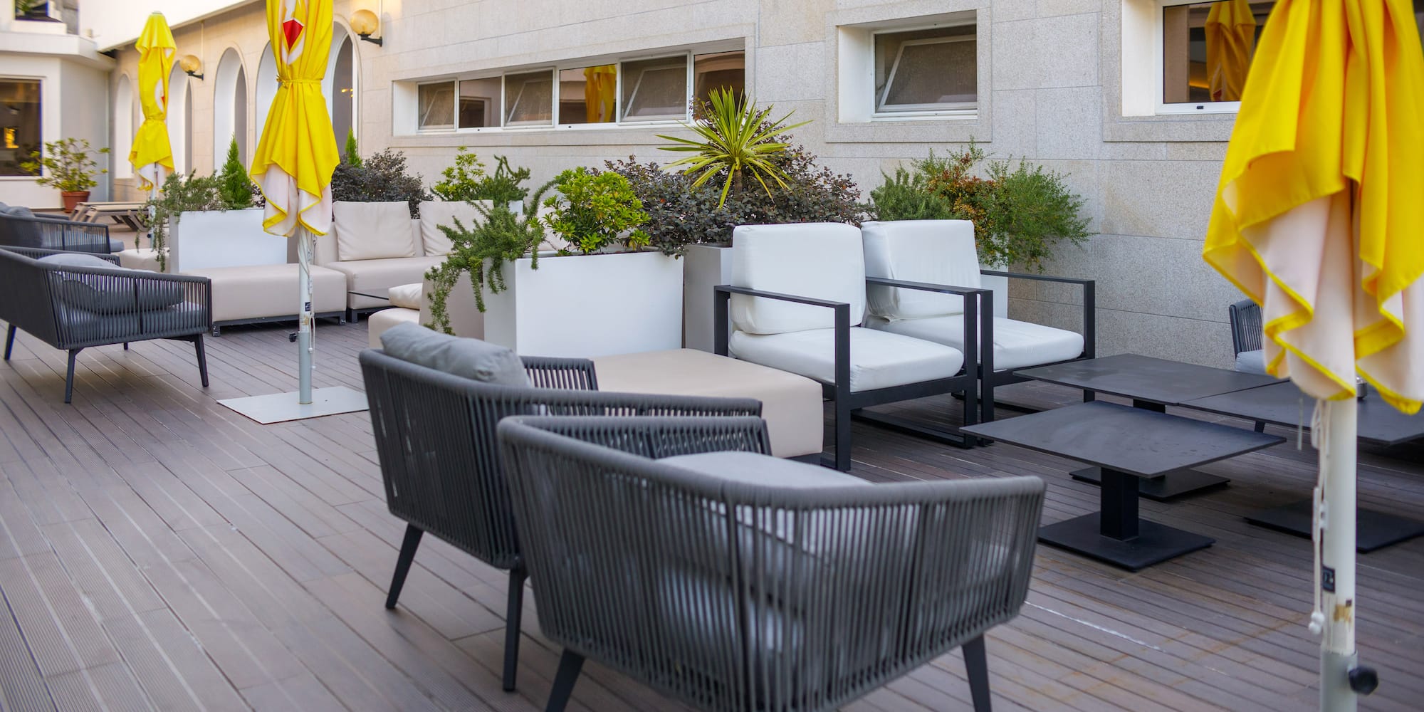 a patio area with chairs and tables