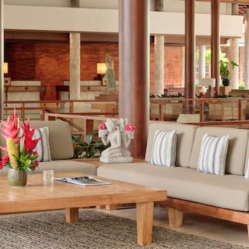 a couches and a coffee table in a lobby