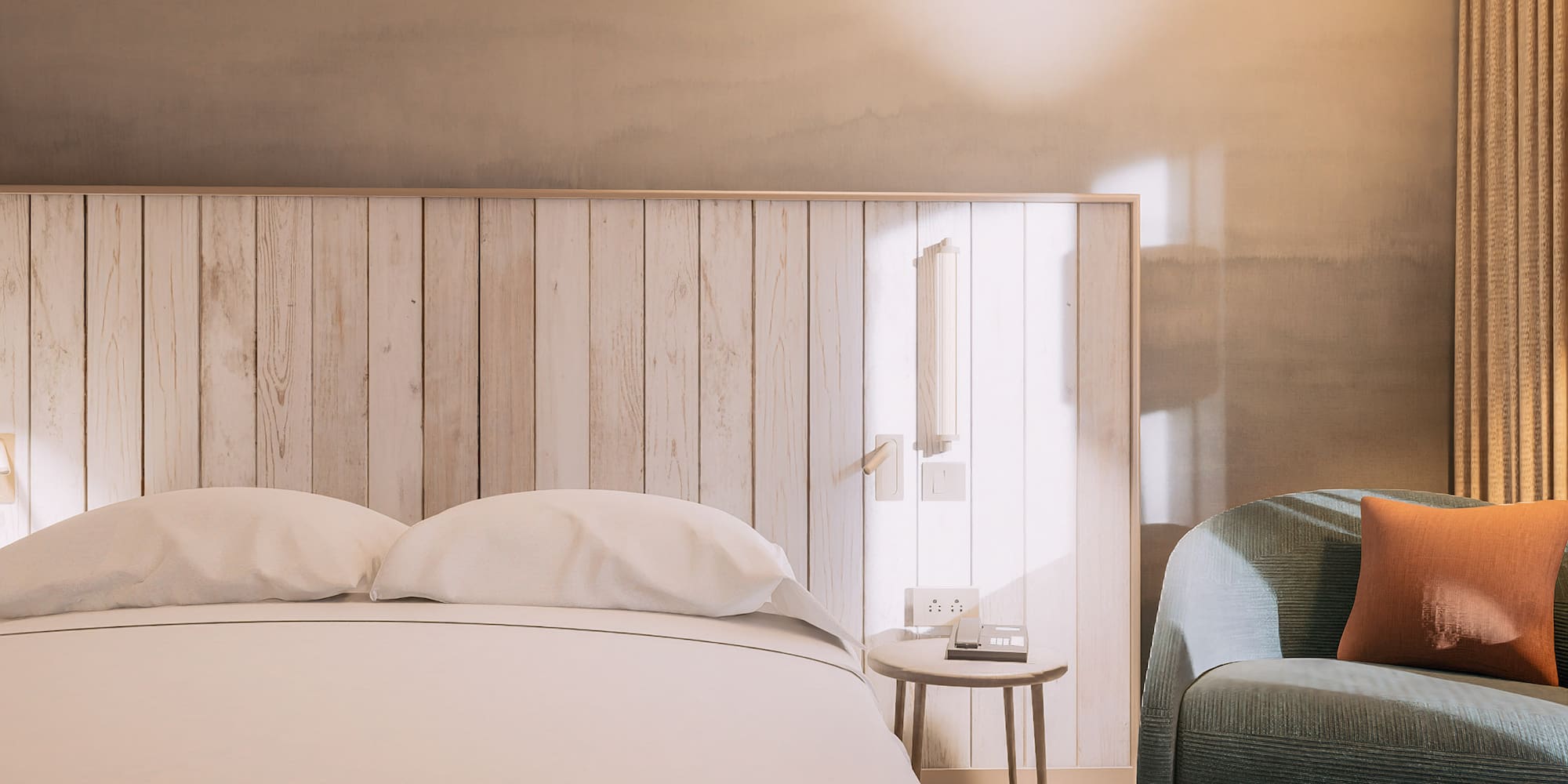 a bed with pillows and a table next to a bed