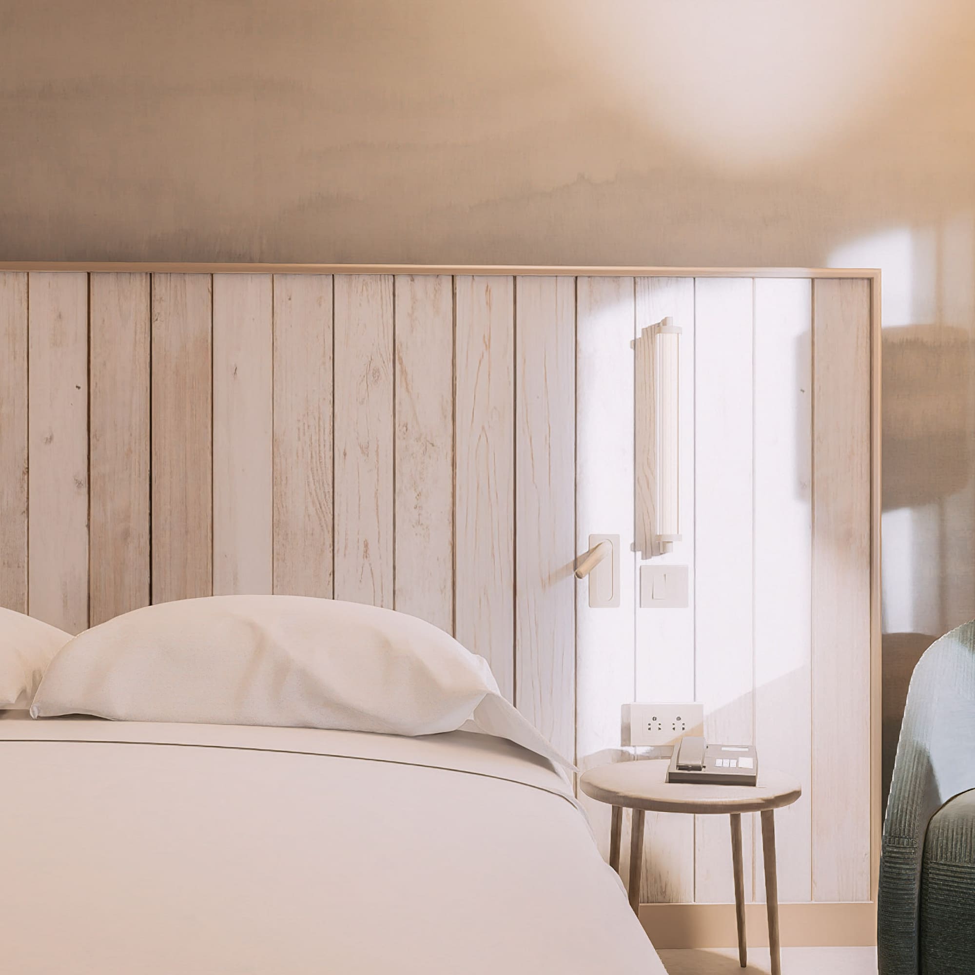 a bed with pillows and a table next to a bed