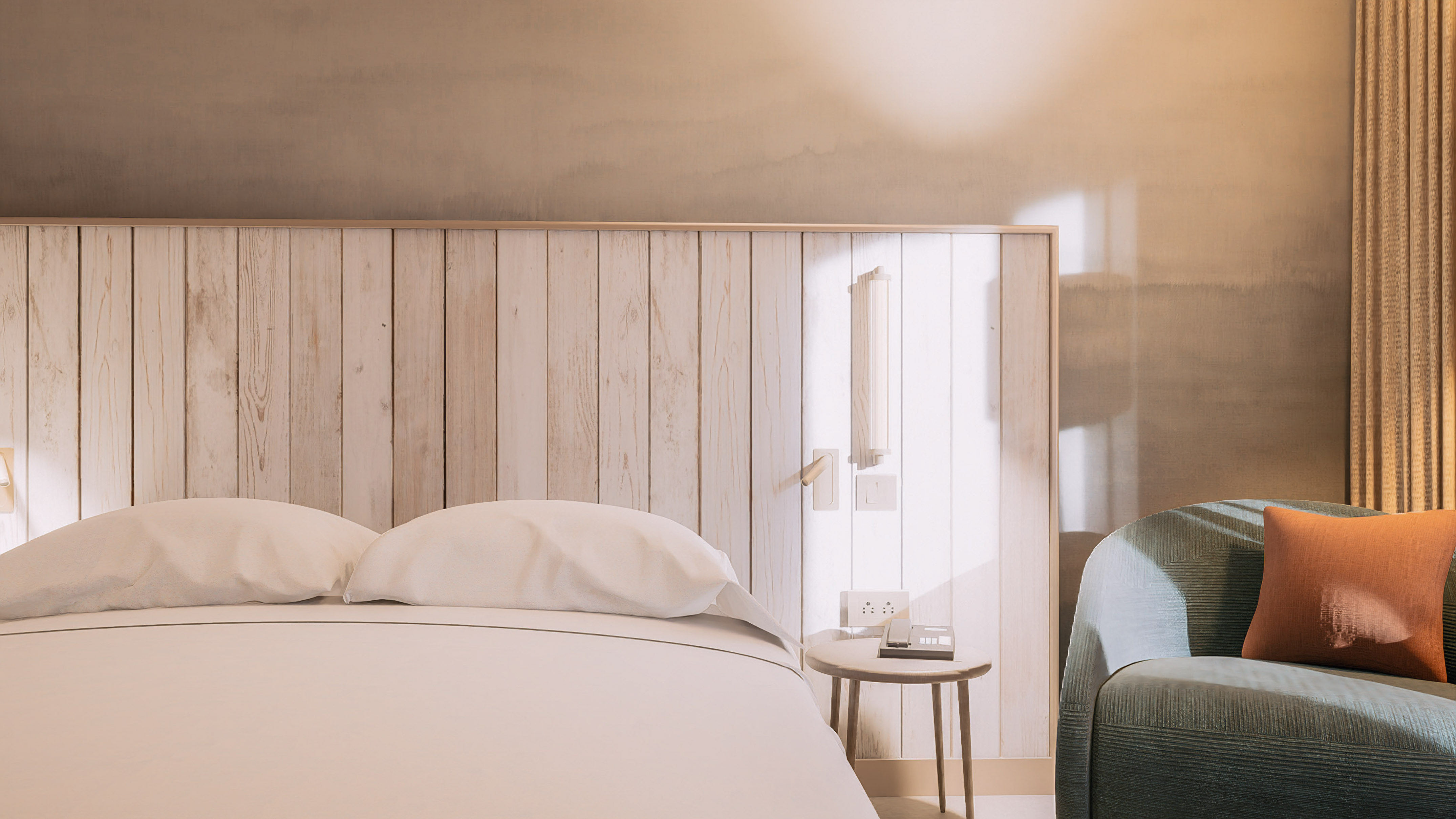 a bed with pillows and a table next to a bed