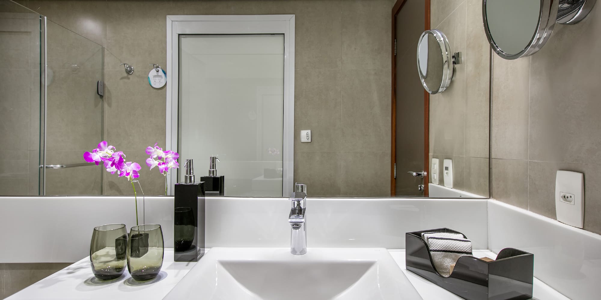 a bathroom with a sink and mirror