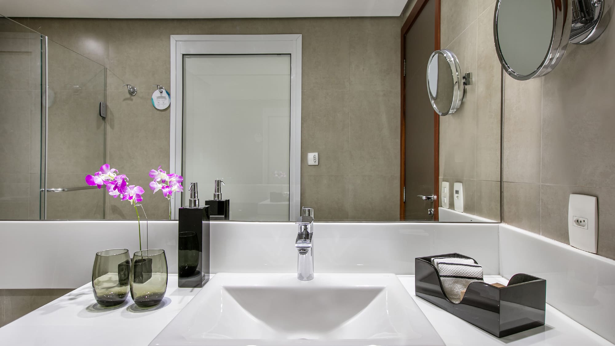 a bathroom with a sink and mirror