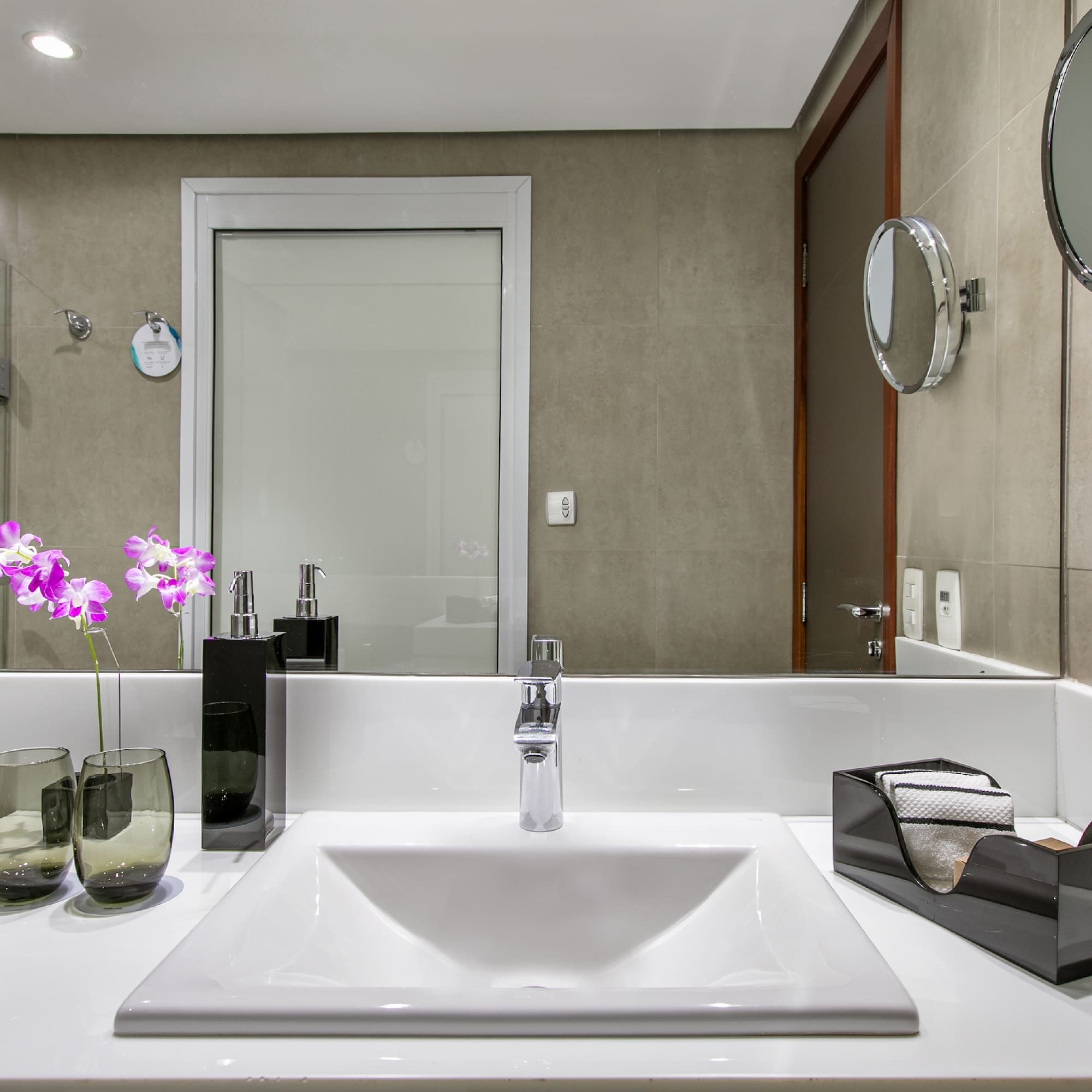 a bathroom with a sink and mirror
