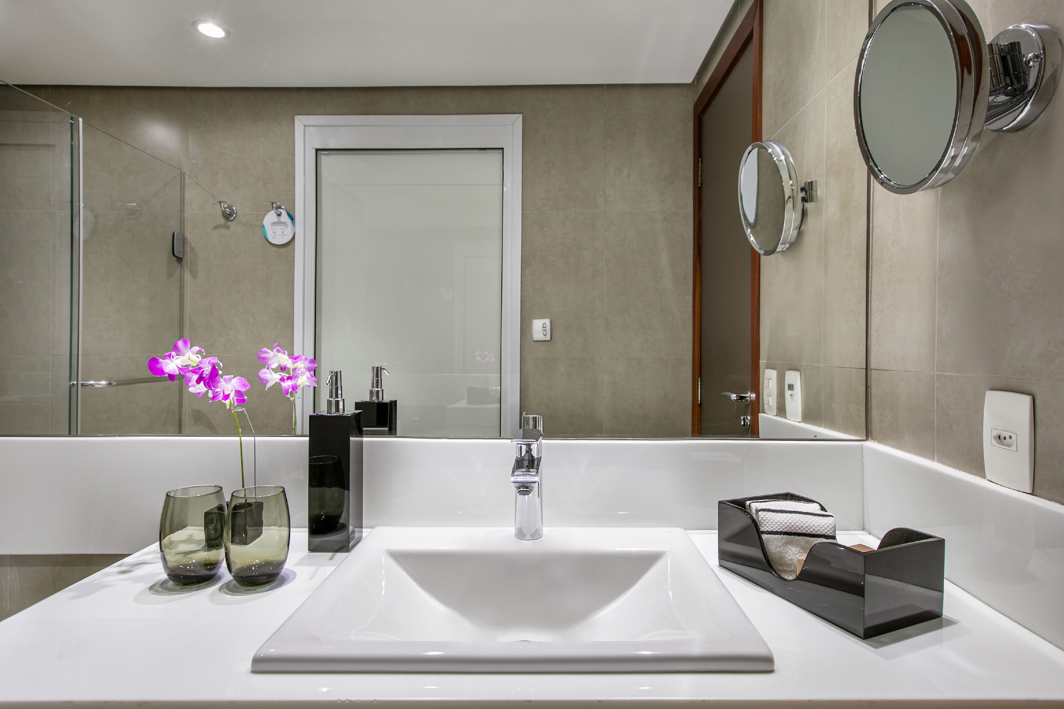 a bathroom with a sink and mirror