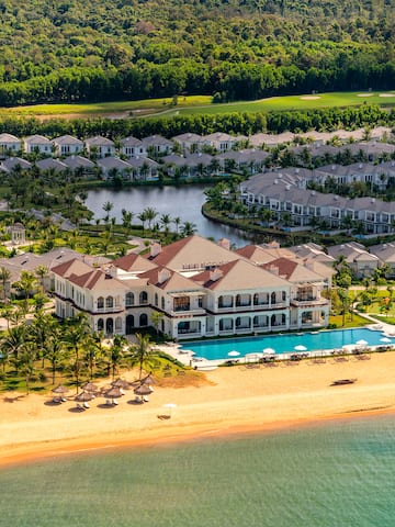 a large resort with a pool and a beach