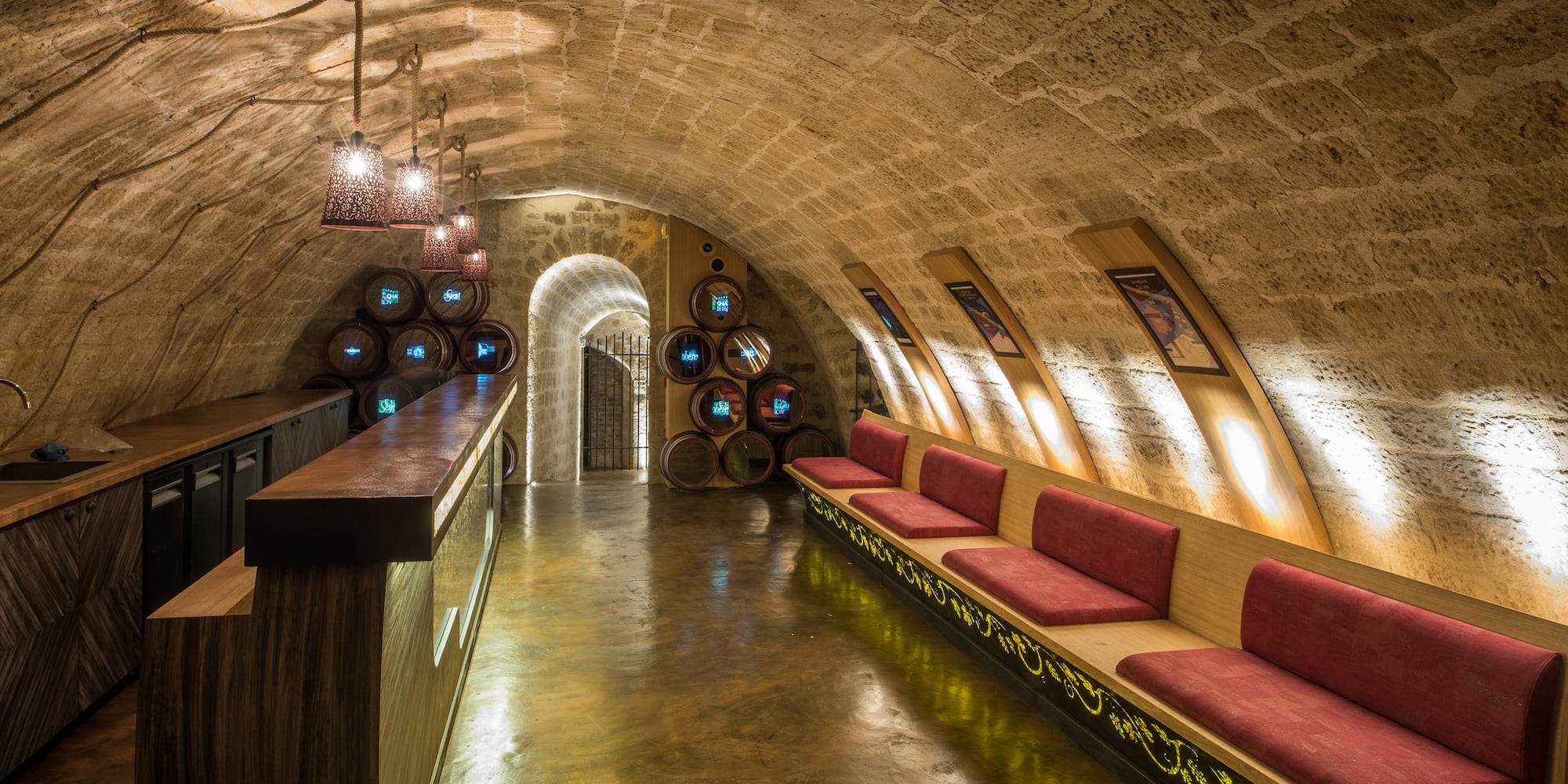 a room with a long bench and a bar