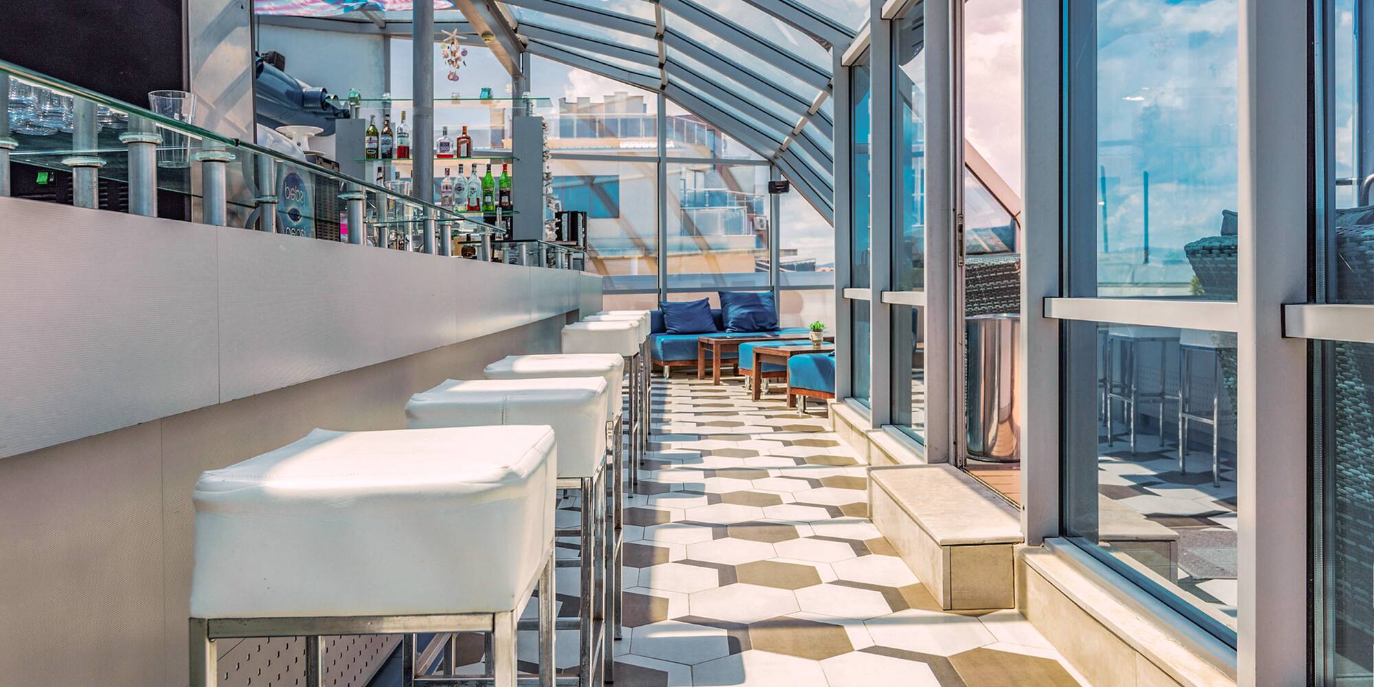 a room with glass walls and tables