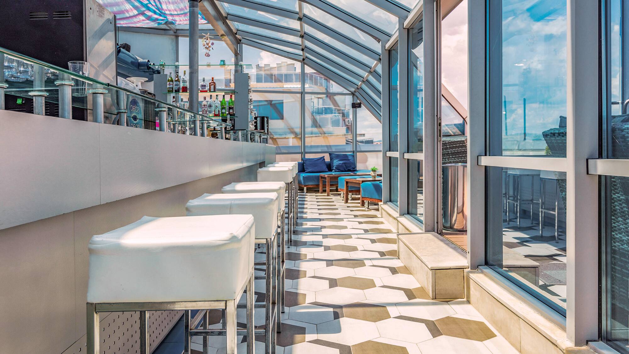 a room with glass walls and tables