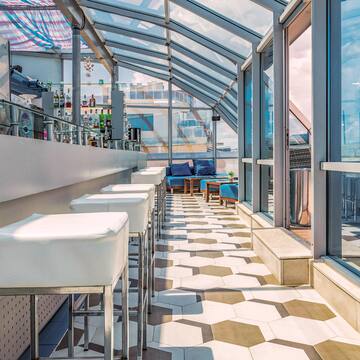 a room with glass walls and tables