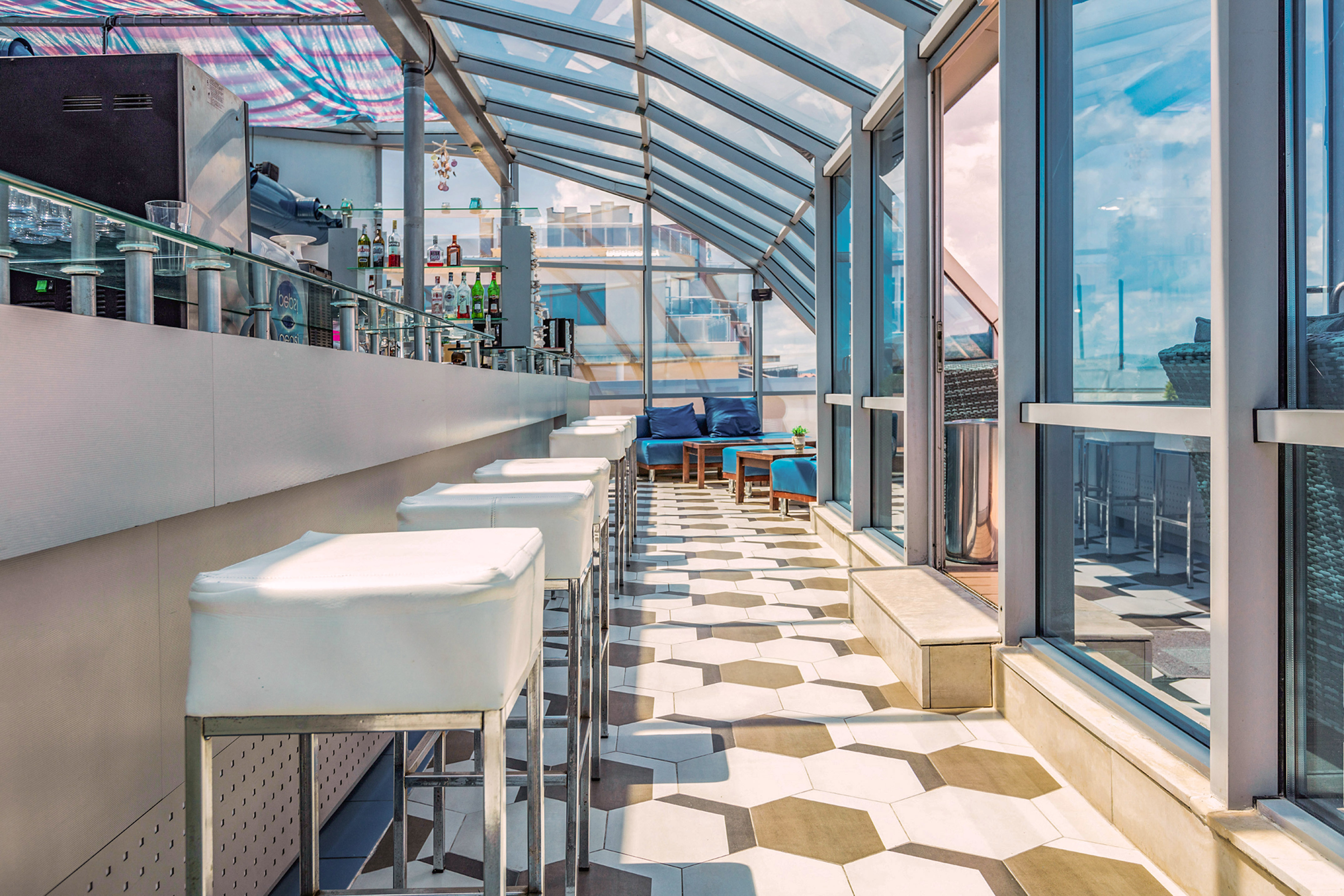 a room with glass walls and tables